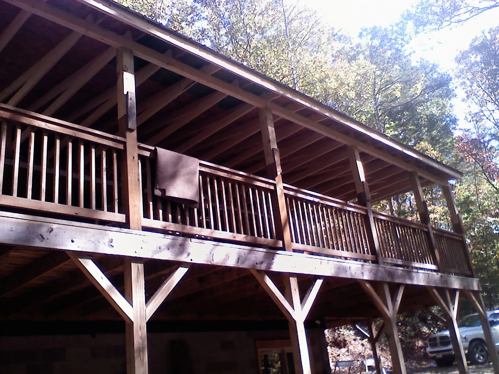 Timber framing under a new elevated porch and deck — Roof Leak Repair in Kittredge by Roofing Brothers